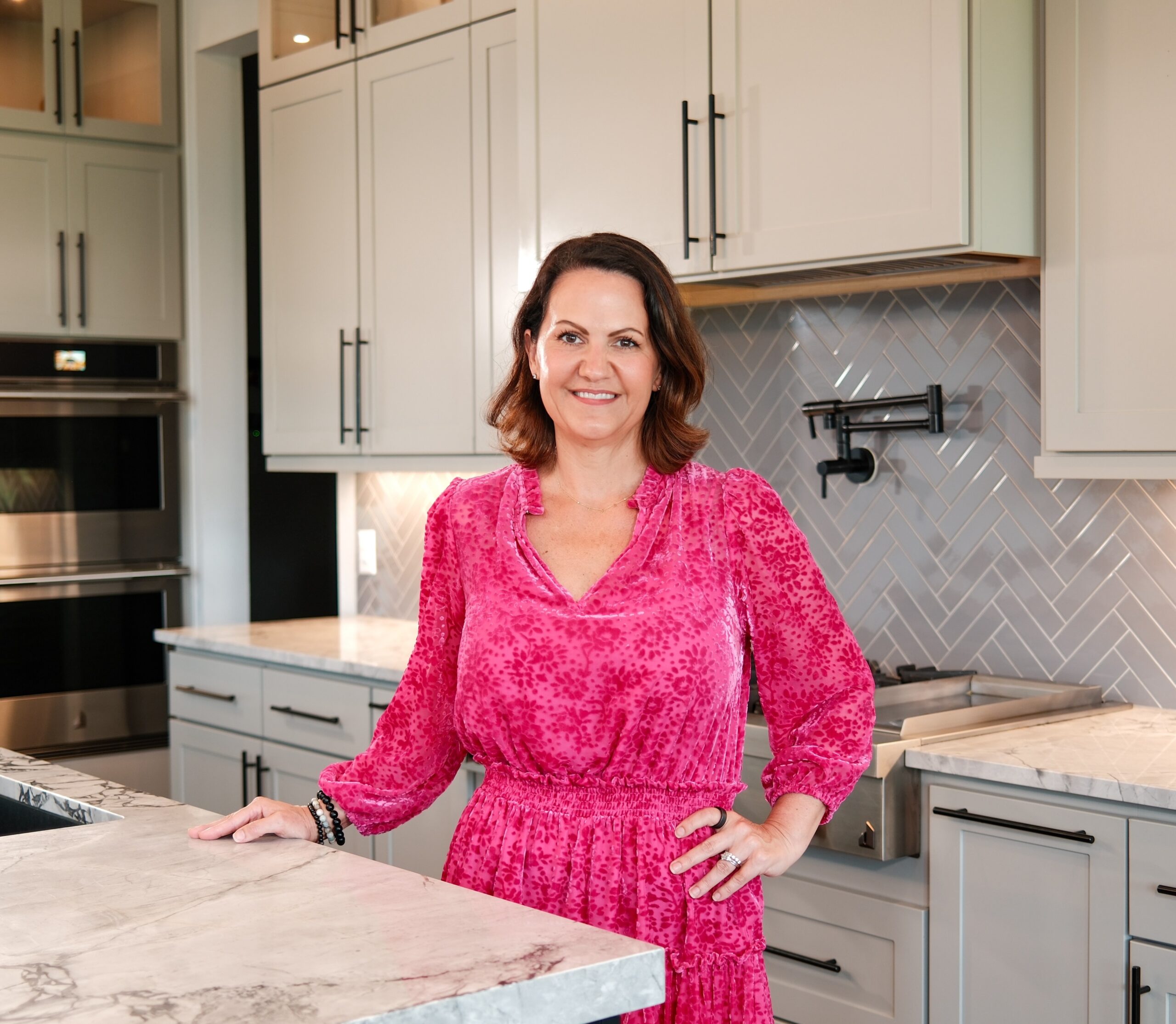 The Jamie McMartin Group, a Houston real estate team, gathered outside a Katy listing