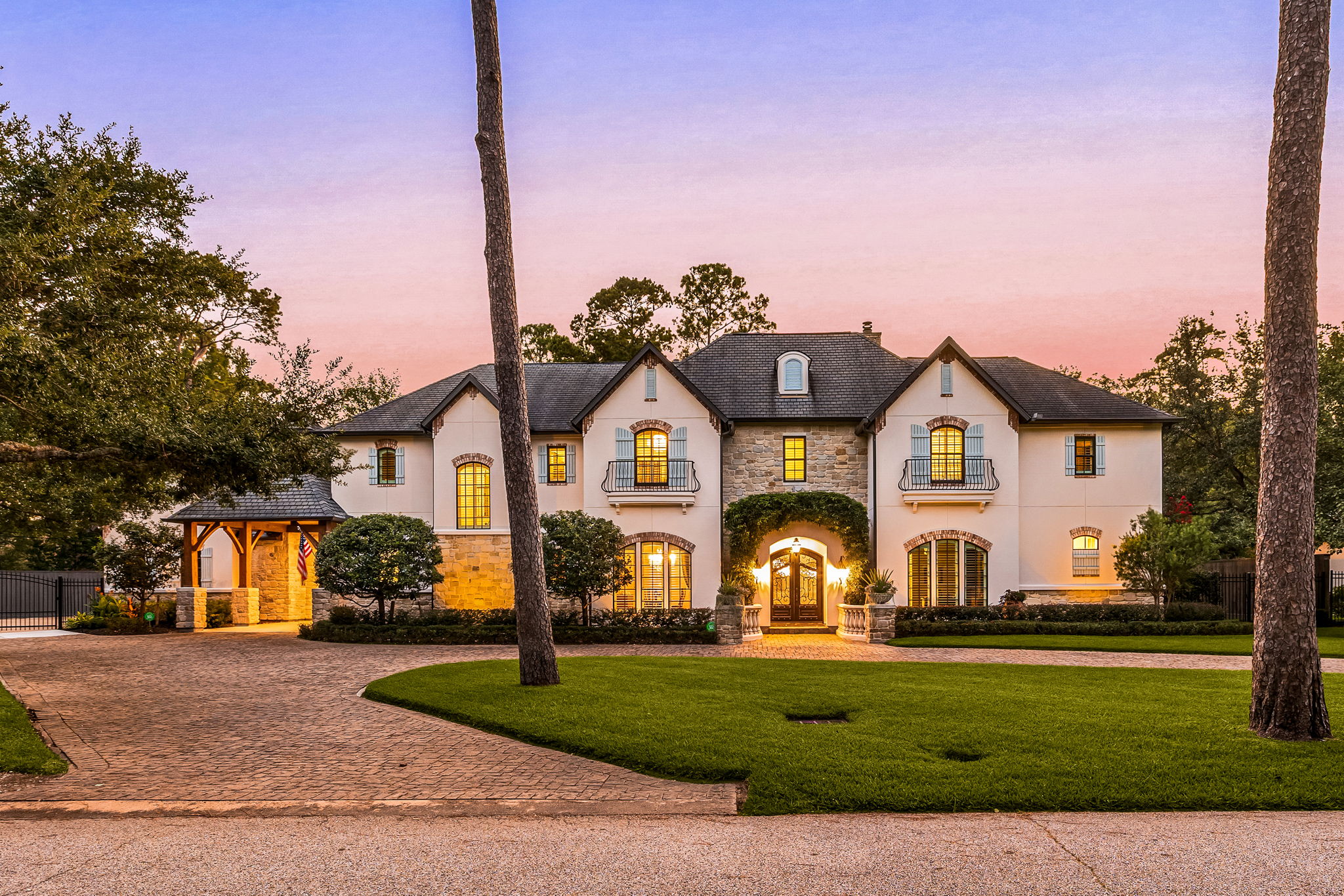 Luxury home at 21 Carolane Trail in Bunker Hill Village with marble entry, hardwood floors, spacious living areas, and backyard pool with spa and outdoor entertaining space.