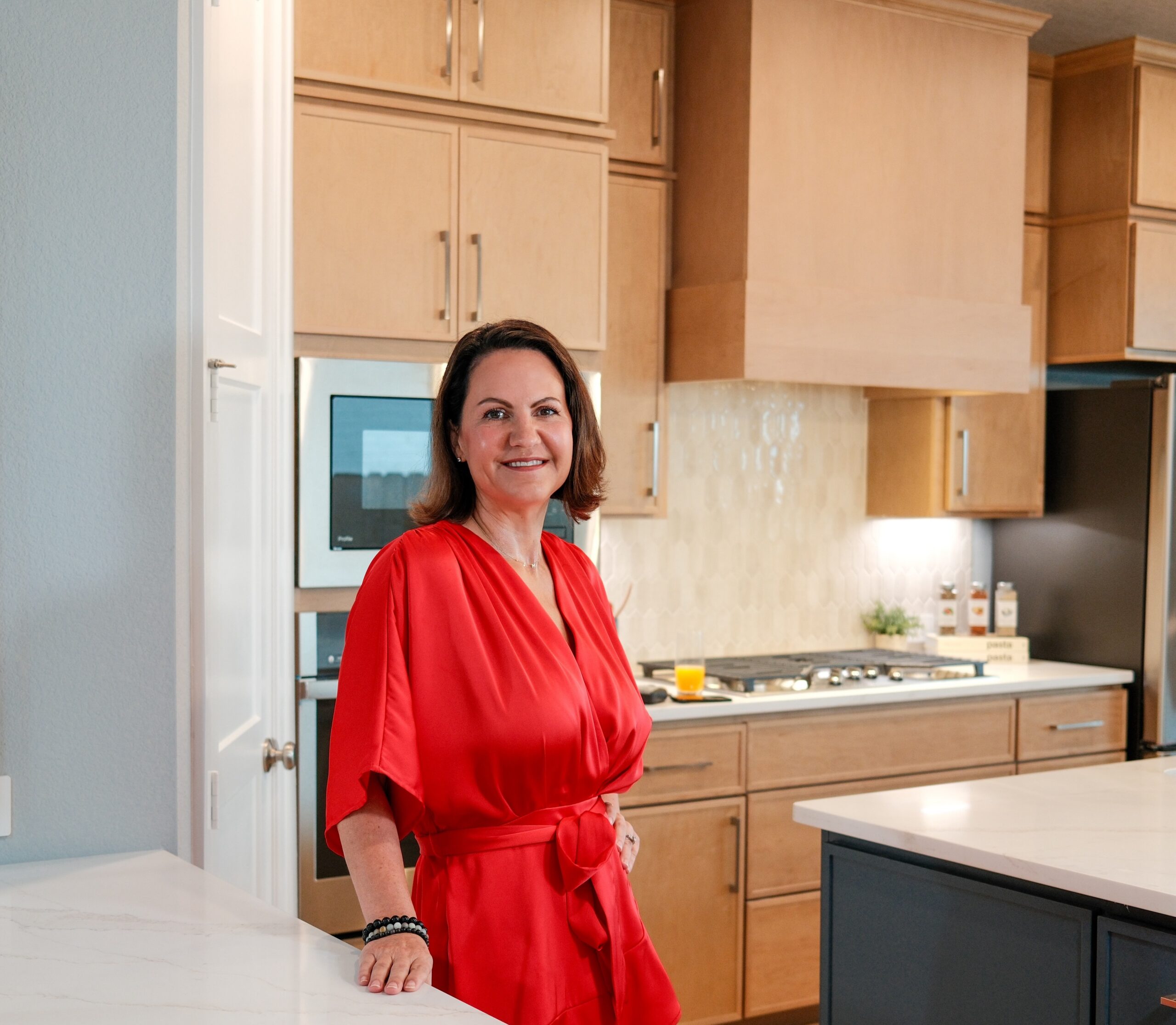 Jamie McMartin, CEO of The Jamie McMartin Group, discusses the Houston home selling market with a client