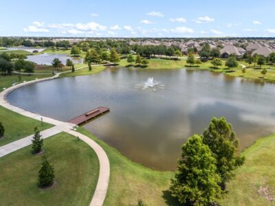 Aliana home for sale surrounded by scenic water features and landscaped spaces, highlighting the master-planned community’s expansive outdoor areas, attractive views, and connected neighborhood design.