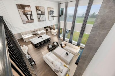 Wine room with motion-activated staircase lighting in Fulshear Run custom home
