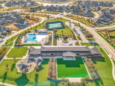 Resort-style amenities at Elyson, including a community pool, tennis courts, walking trails, and open green spaces in a master-planned Katy neighborhood.