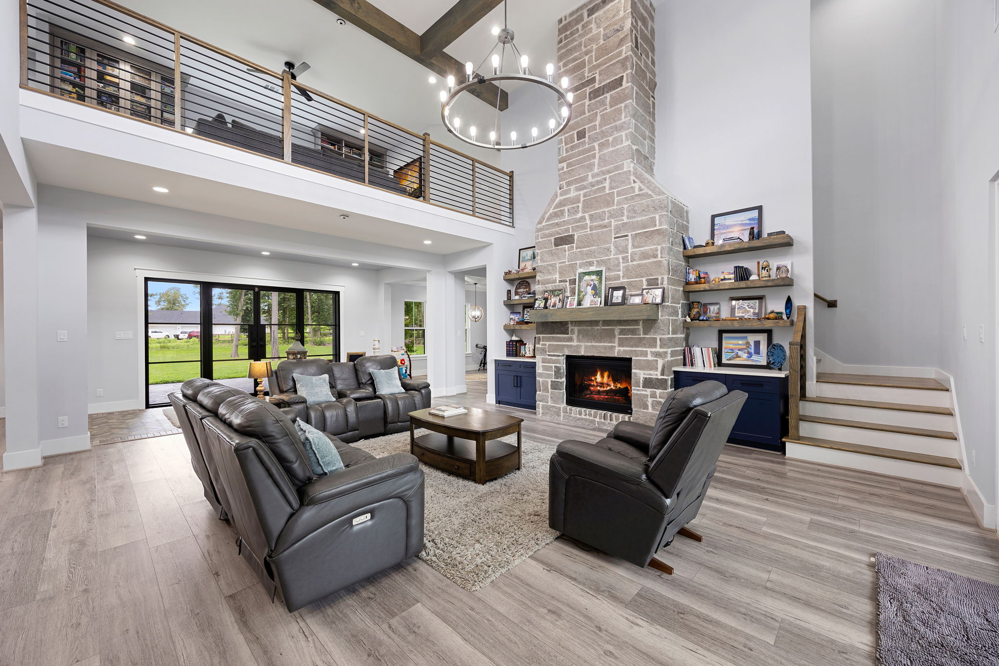 Fall home maintenance Houston check before cozy nights by a stone fireplace in a vaulted Houston living room
