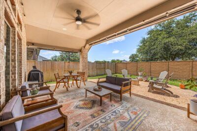 Covered patio and backyard highlighted in updated Cane Island listing photos