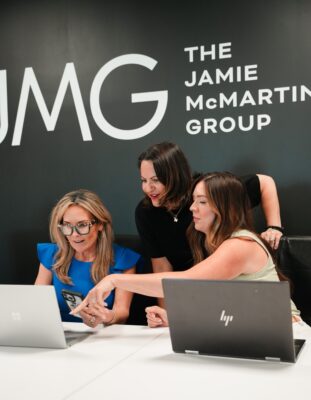 amie McMartin of The Jamie McMartin Group reviewing pricing and concession options with Katy homeowners
