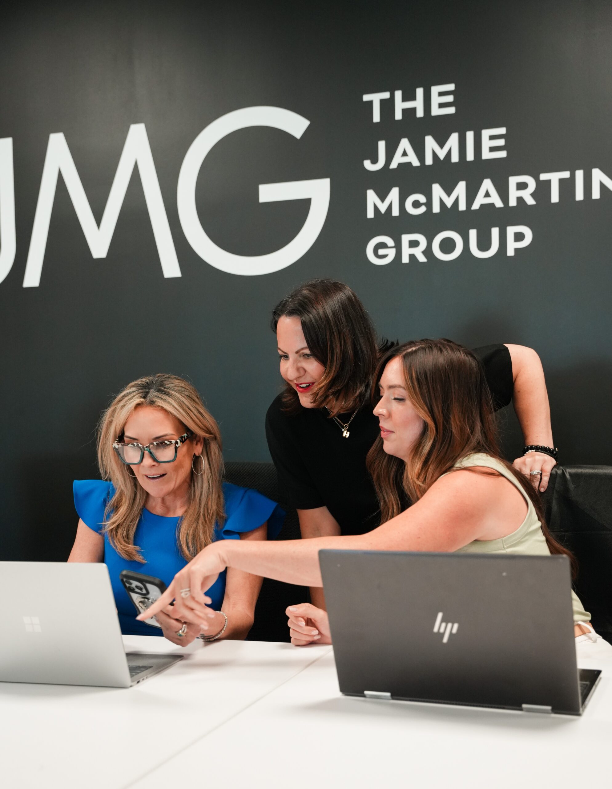 amie McMartin of The Jamie McMartin Group reviewing pricing and concession options with Katy homeowners